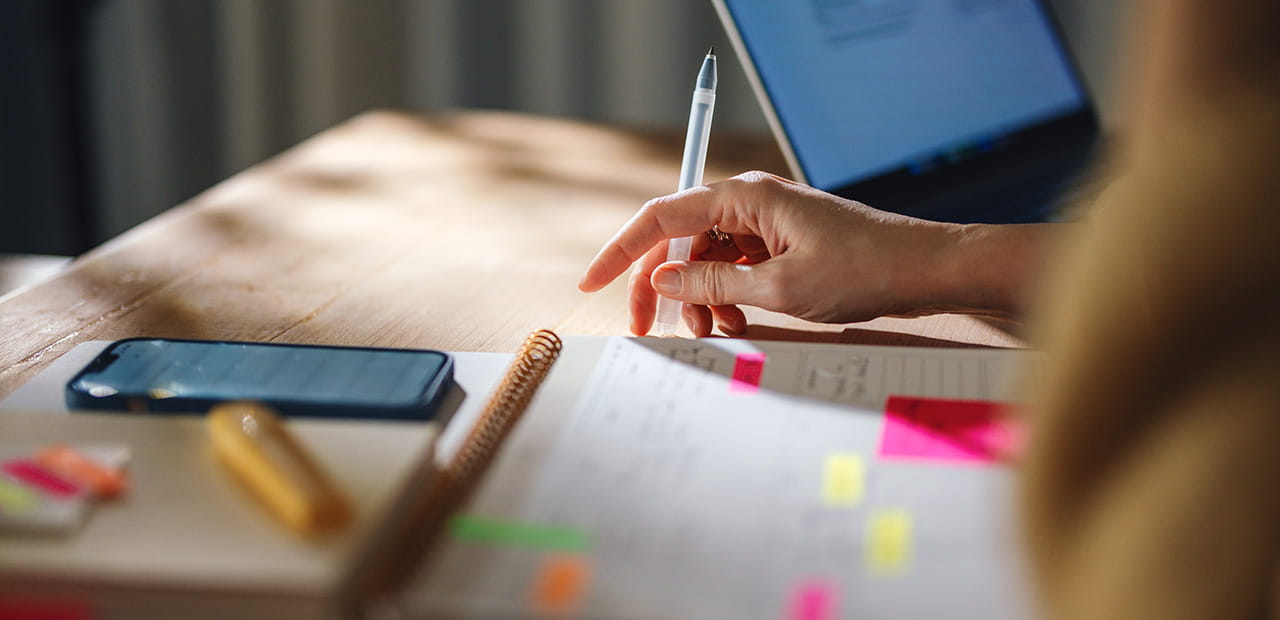 Small business owner using digital tools to explore AI-powered productivity solutions.