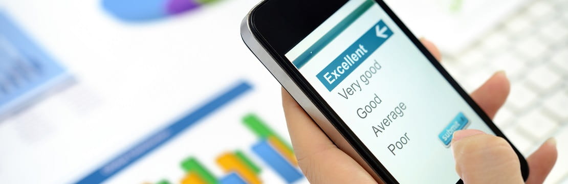 Cell phone shows a list of survey response options.
