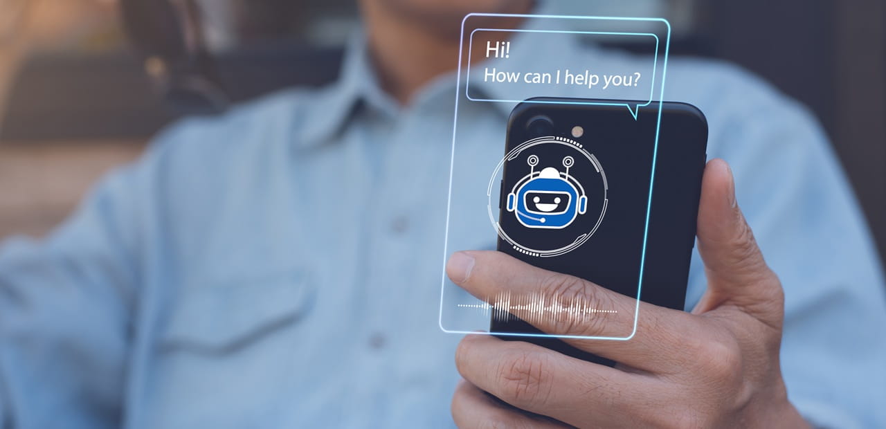 Person using a smartphone with an AI chatbot interface, illustrating how AI chatbots are widely available through mobile apps and digital tools for everyday use.