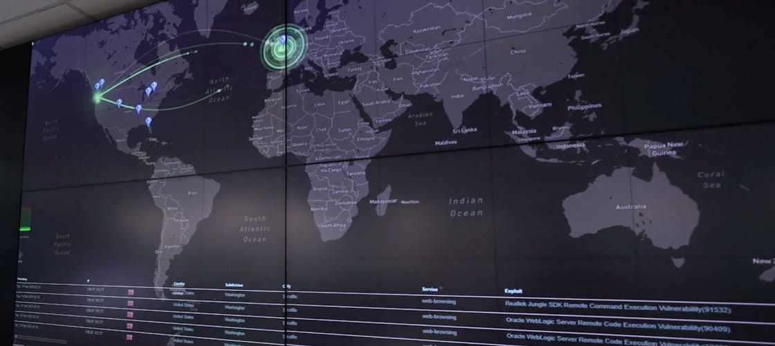 Cybersecurity dashboard displaying a world map with animated network activity and highlighted security threats across multiple regions.