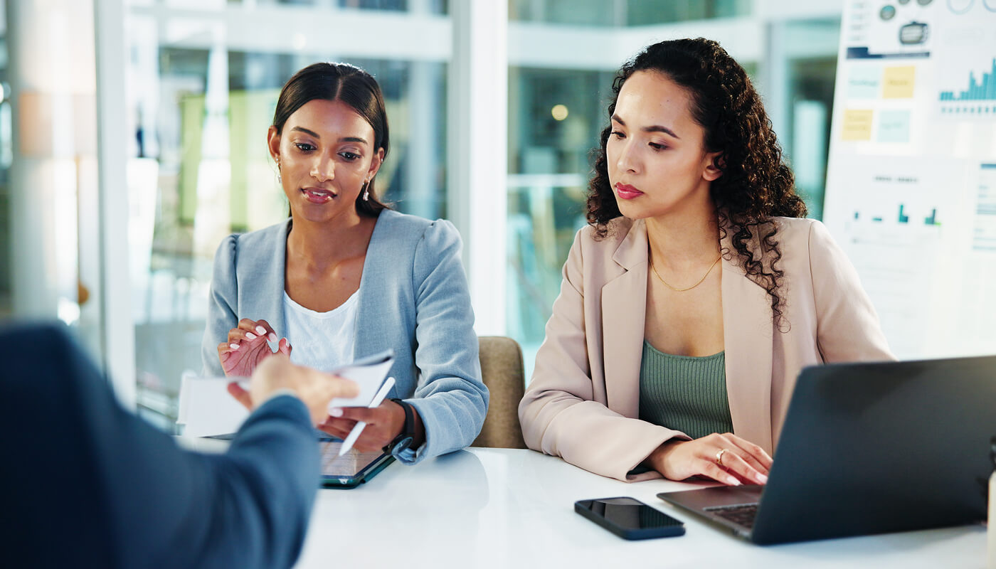 Business, discussion and people with documents in meeting to assess financial performance, forecasting or planning. Finance manager, teamwork or stats report for timeline review or cash flow analysis