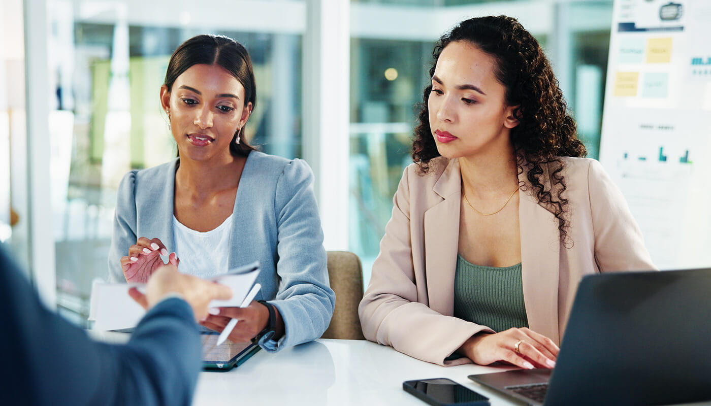 Business, discussion and people with documents in meeting to assess financial performance, forecasting or planning. Finance manager, teamwork or stats report for timeline review or cash flow analysis