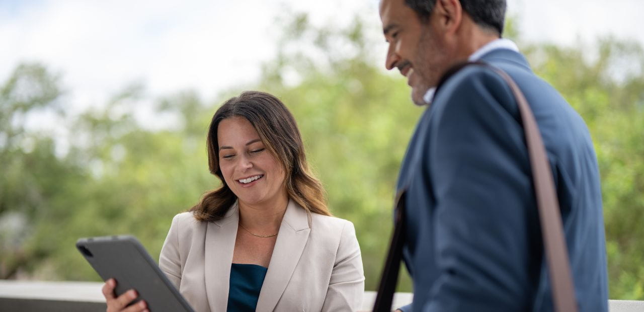 Two businesspeople looking at iPad